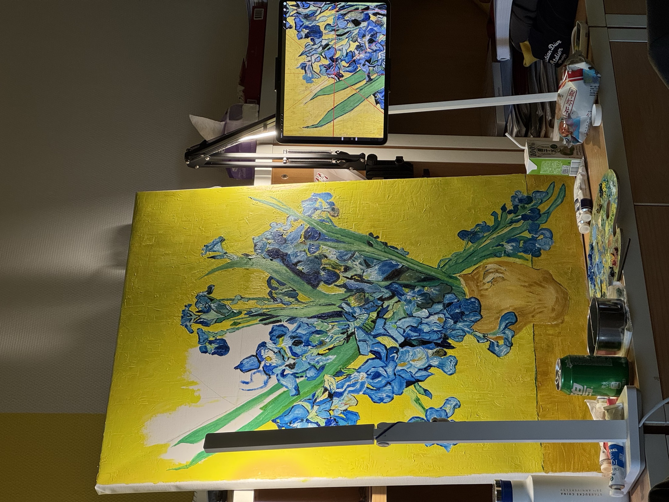 In-progress photo of a blue flowers painting on an easel