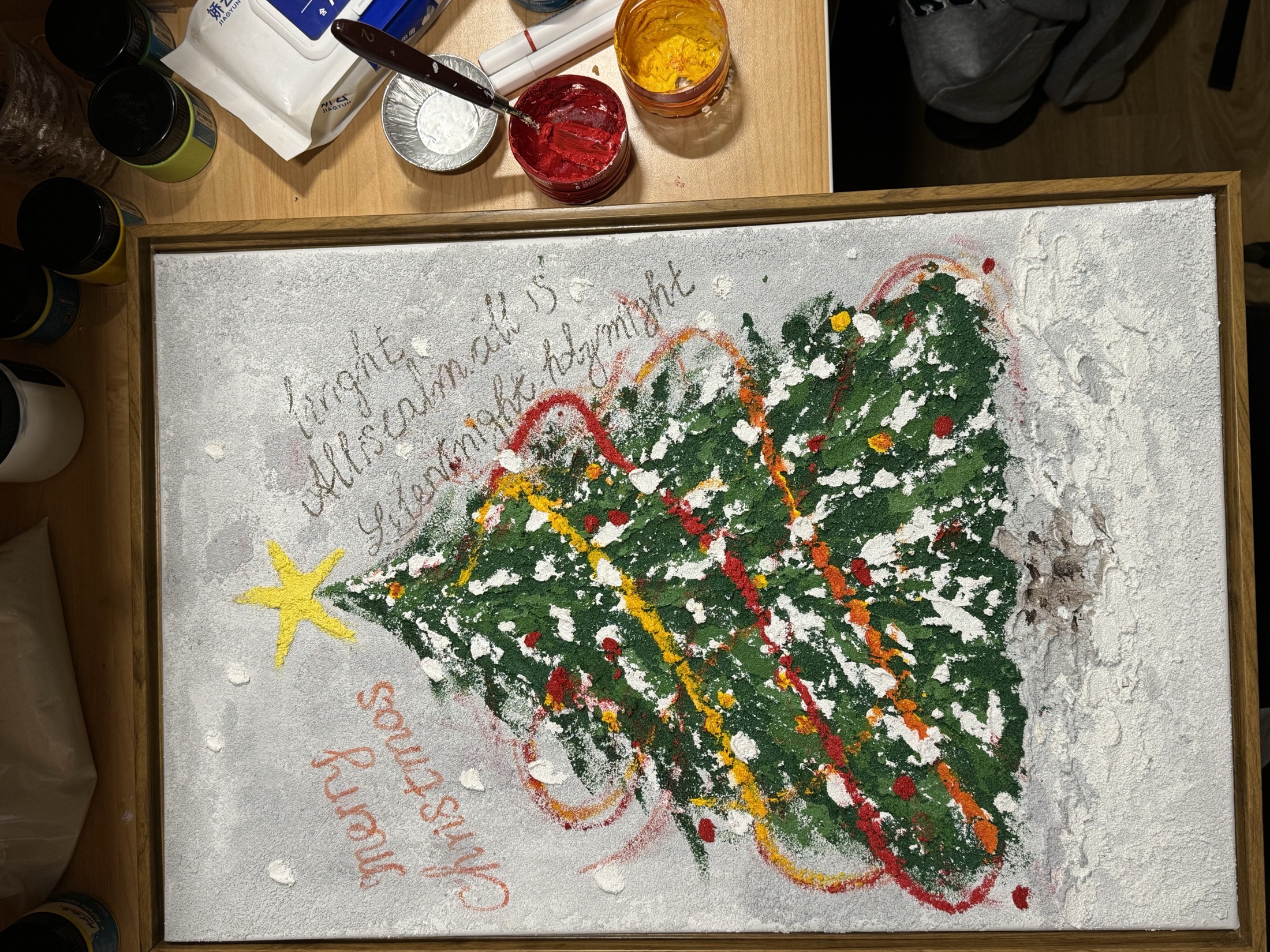 Textured Christmas tree painting with snow and handwritten text