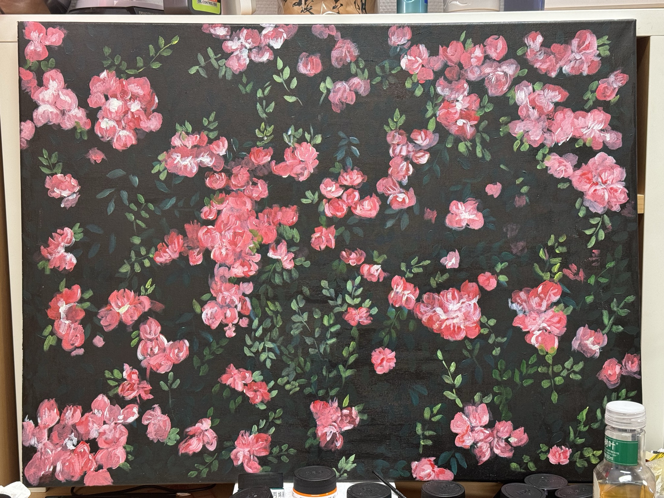 Pink floral painting on a dark background