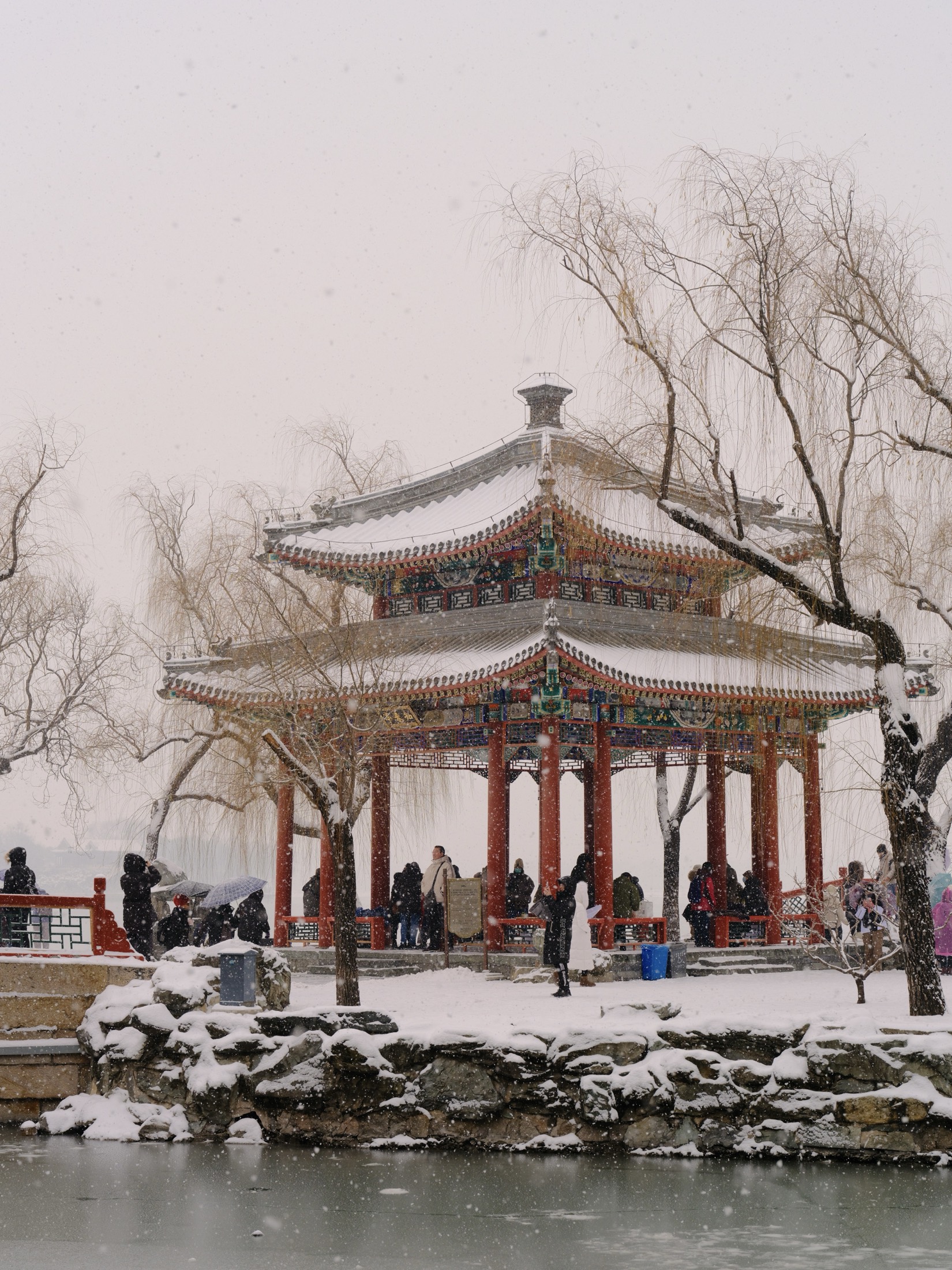 Snow falling around a pavilion