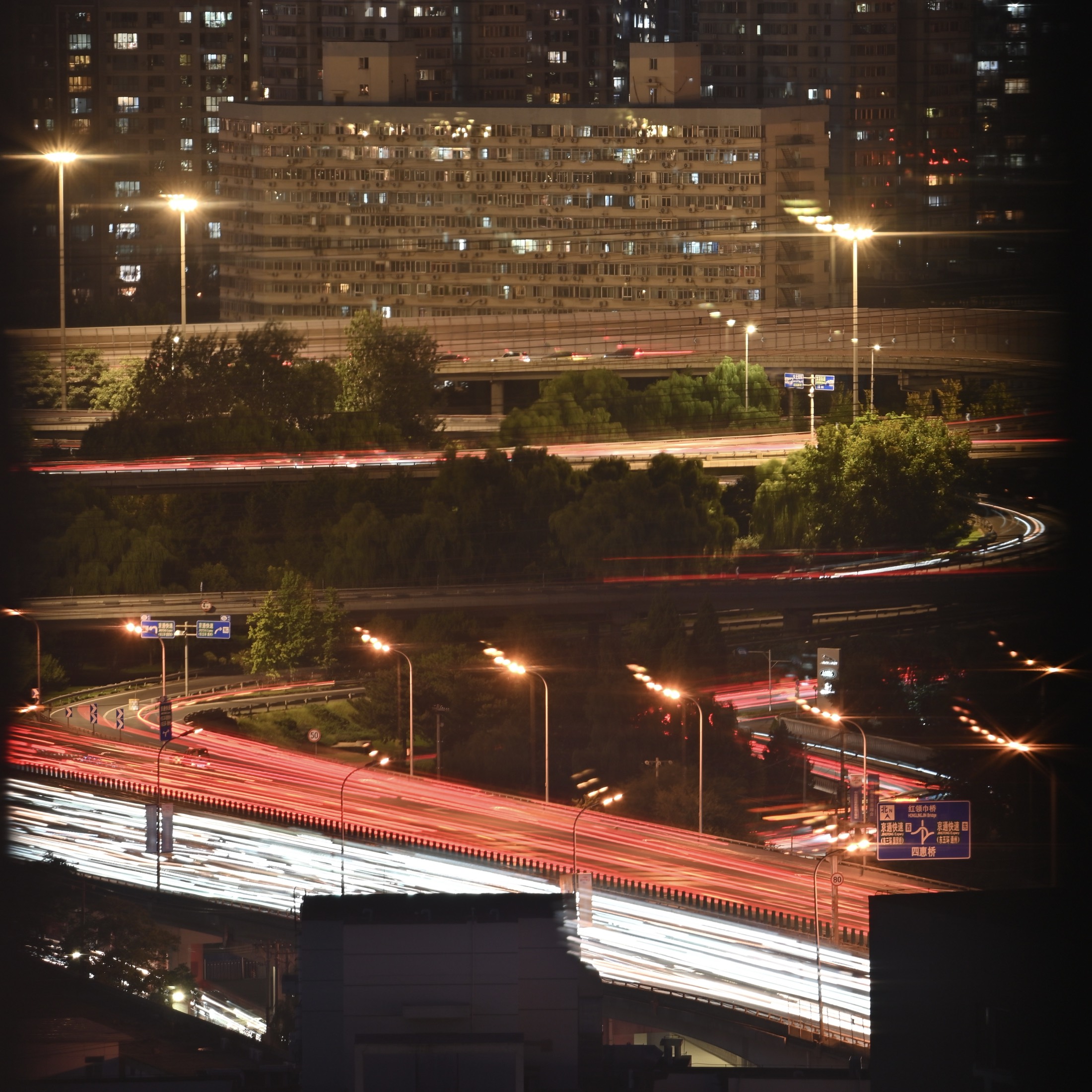 Night traffic light trails through a city